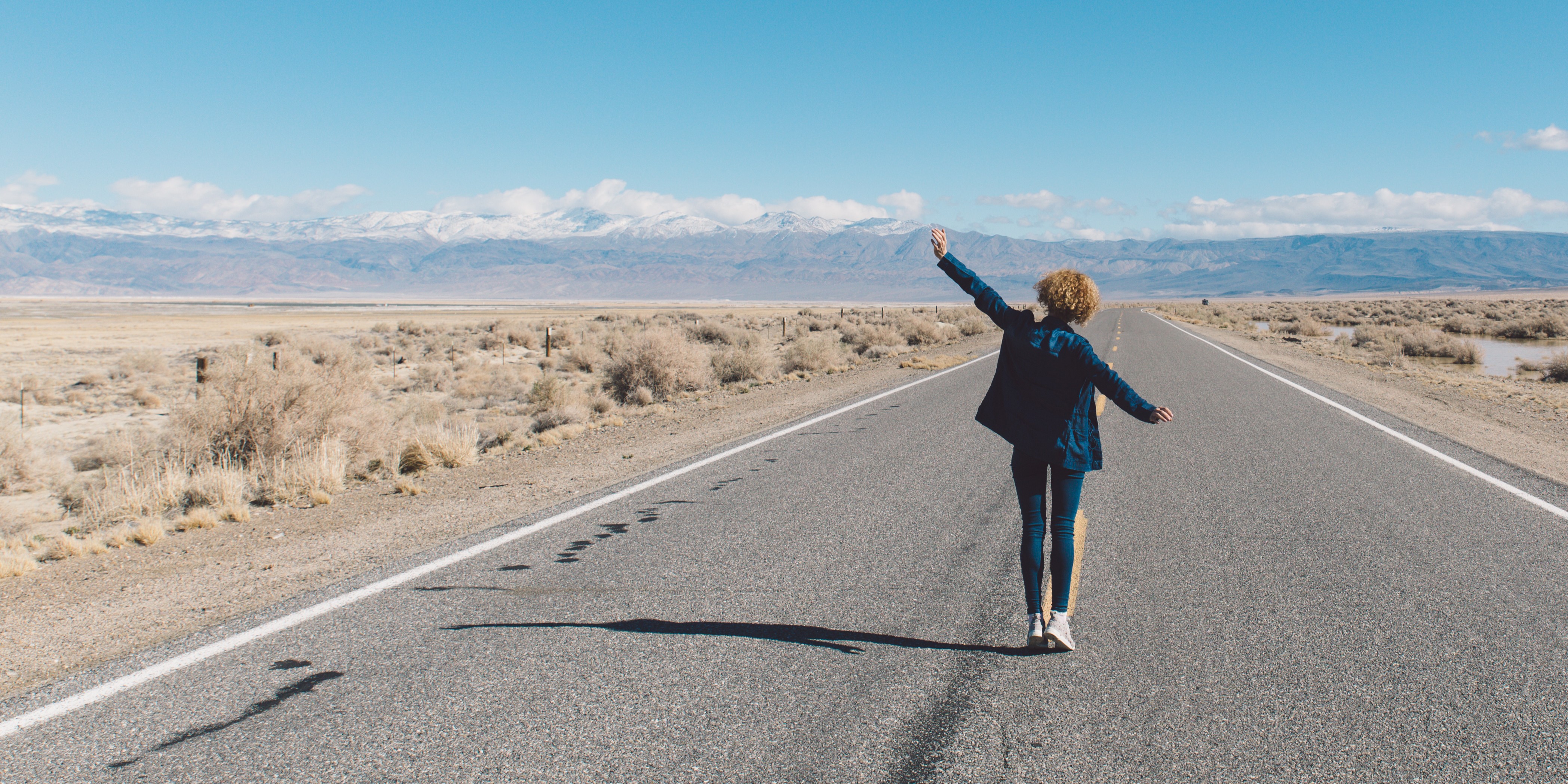 person walking on road